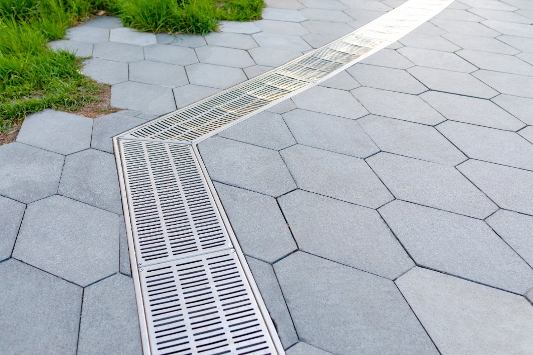 A subtle and beautiful French drain system.