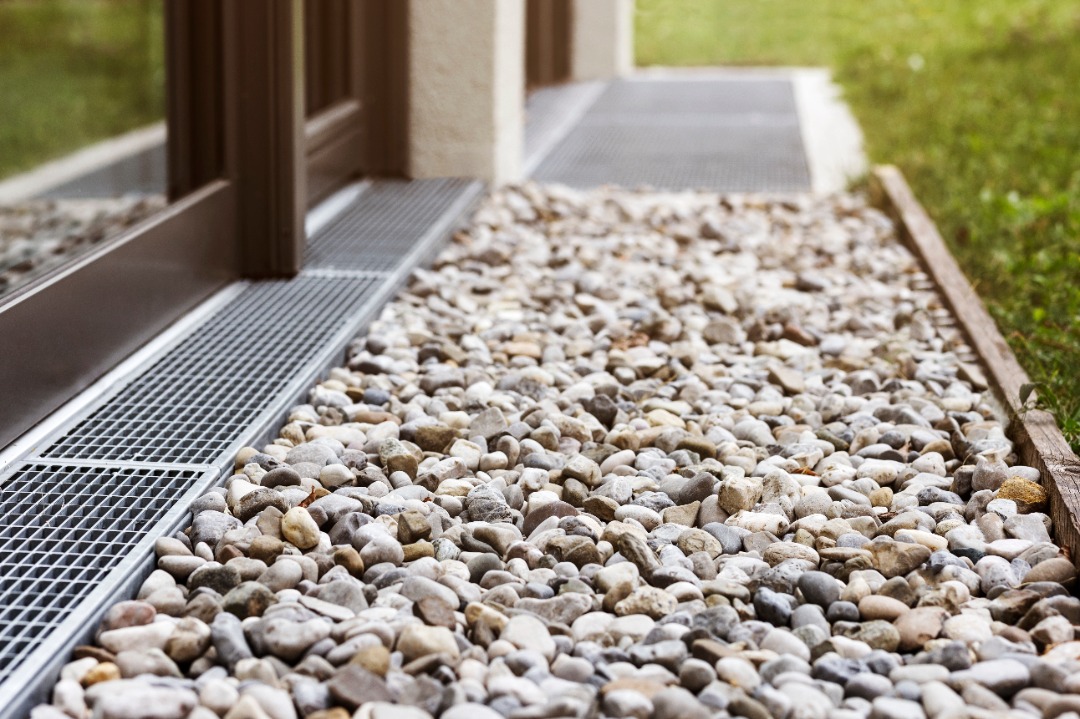 A seamless French drainage system with new rocks as well.